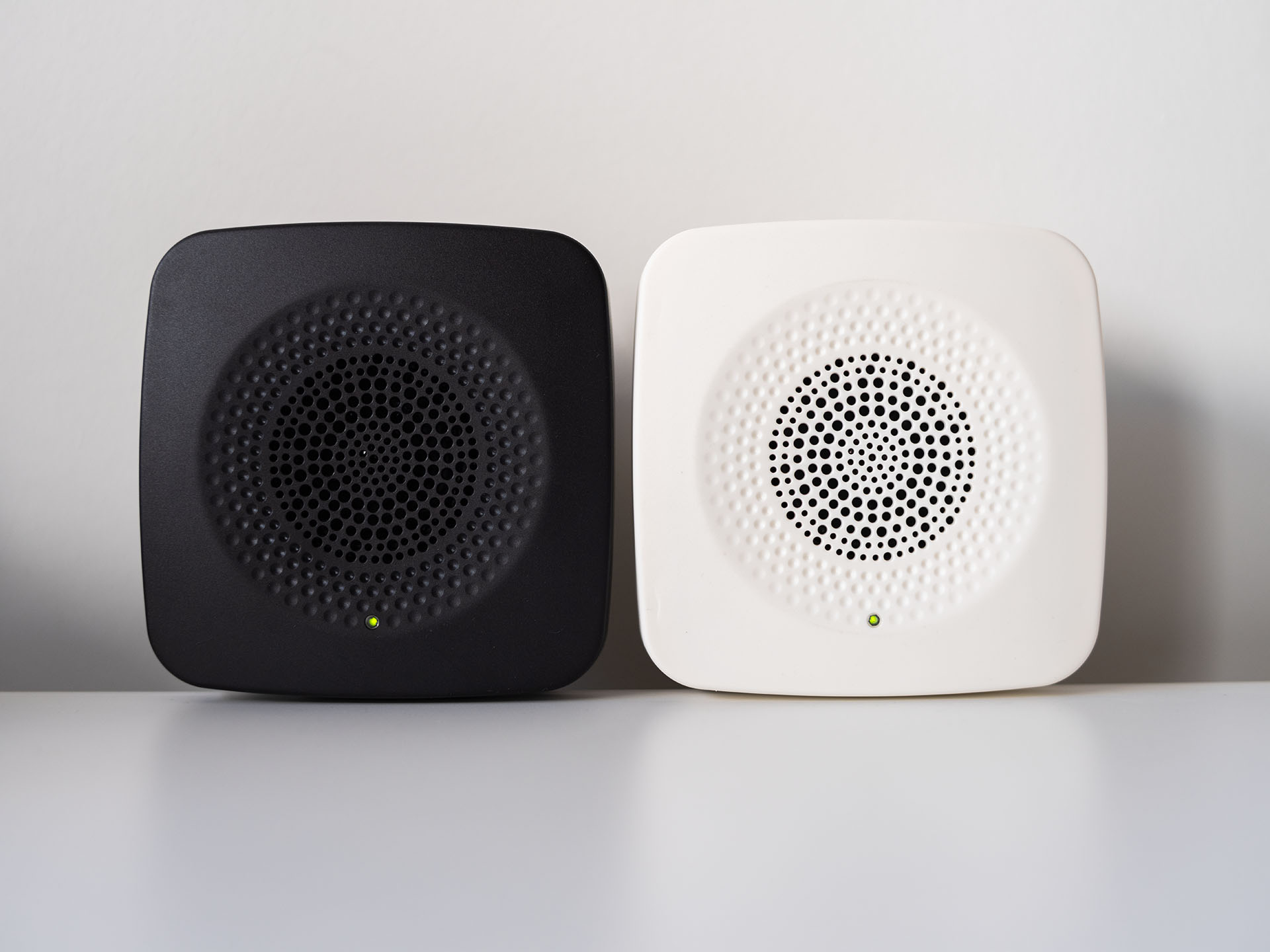 Two audio audio beacons, black and white
